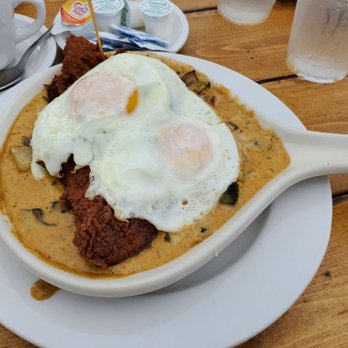 Honeybear Cafe - Cajun catfish and jalapeño cheddar grits (minus bacon) - decadent and huge catfish fillet under those eggs - Breakfast & Brunch Near Me - Chicago, Illinois