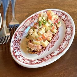 Joe Beef - Appetizer of lobster salad on a crispy wafer.