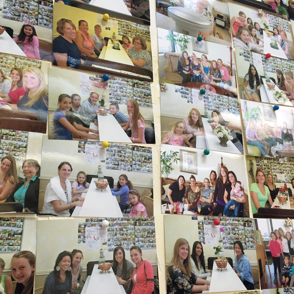 A wall of pictures of happy customers!