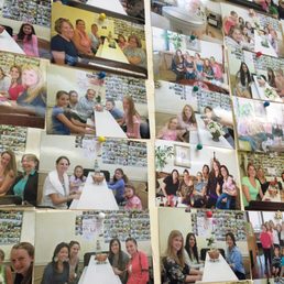 A wall of pictures of happy customers!