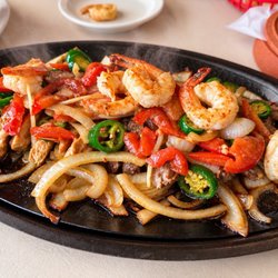 Delia’s Paradillas - Fajitas beef, chicken and shrimp with a lot of onions.