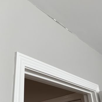 Zarrella Development - a view of a door with a crack in the wall - General Contractors Near Me - East Greenwich, Rhode Island Zarrella Development - a view of a door with a crack in the wall - General Contractors Near Me - East Greenwich, Rhode Island