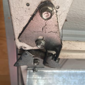 Rollit Garage Doors - Broken hinge - Garage Door Services Near Me Rollit Garage Doors - Broken hinge - Garage Door Services Near Me