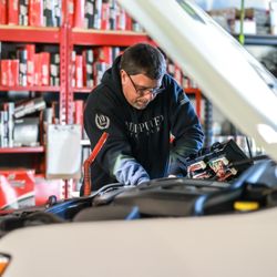 Undisputed Auto Care - Tech working on customers vehicle