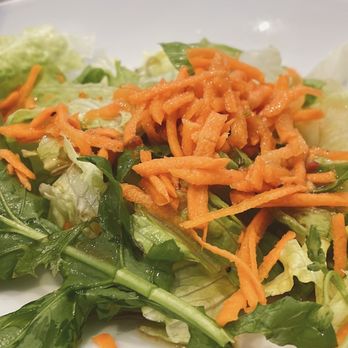 Perbacco - a salad with carrots and lettuce - Italian Near Me - Houston, Texas