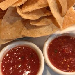 Chips with medium and hot salsa.
