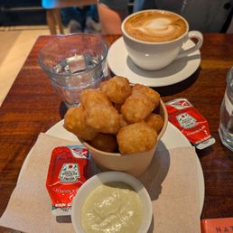 Tater tots and a flat white Tater tots and a flat white