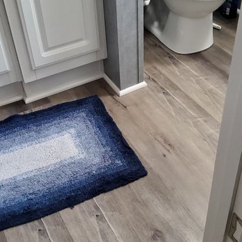 HG Flooring - they even remove the toilet and install under and then reinstall - Flooring Near Me
