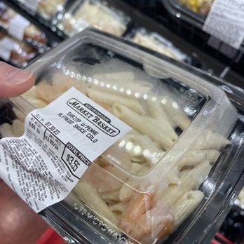 Market Basket - a hand holding a container of pasta - Grocery Near Me - Nashua, New Hampshire Market Basket - a hand holding a container of pasta - Grocery Near Me - Nashua, New Hampshire