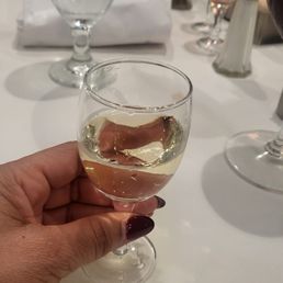 A small glass of wine. A small glass of wine.