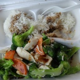 chicken, broccoli, and rice in a styrofoam container