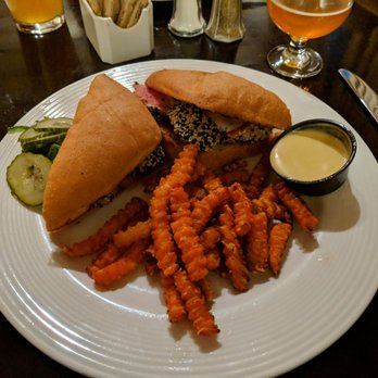 Wrought Iron Grill - Seared ahi tuna sandwich with sweet potato fries - American Near Me - Owosso, Michigan Wrought Iron Grill - Seared ahi tuna sandwich with sweet potato fries - American Near Me - Owosso, Michigan
