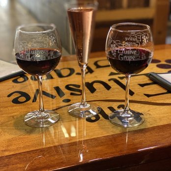 Elusive Grape - two glasses of wine on a bar - Beer, Wine & Spirits Near Me - Deland, Florida Elusive Grape - two glasses of wine on a bar - Beer, Wine & Spirits Near Me - Deland, Florida