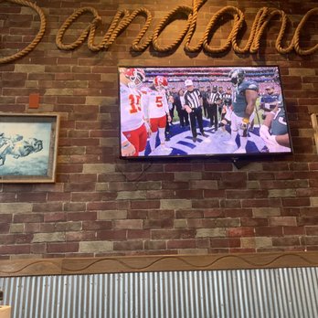 Bandana's Bar-B-Q - ows a television mounted on a brick wall - Barbeque Near Me - Saint Peters, Missouri Bandana's Bar-B-Q - ows a television mounted on a brick wall - Barbeque Near Me - Saint Peters, Missouri