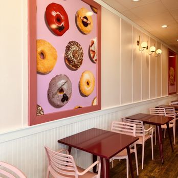 Chubby Baker - a row of tables with doughnuts on the wall - Desserts Near Me - Orem, Utah