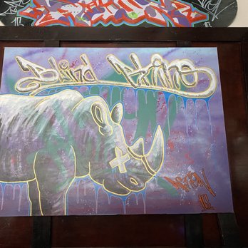 The Blind Rhino - a painting of a rhino with graffiti on it - Sports Bars Near Me - South Norwalk, Connecticut The Blind Rhino - a painting of a rhino with graffiti on it - Sports Bars Near Me - South Norwalk, Connecticut