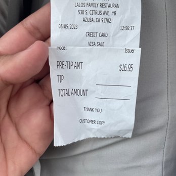 Lalo's Restaurant - a person holding a receipt - Mexican Near Me - Azusa, California Lalo's Restaurant - a person holding a receipt - Mexican Near Me - Azusa, California