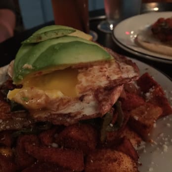 Ocho - Papas bravas with egg and avocado - Lounges Near Me - San Antonio, Texas