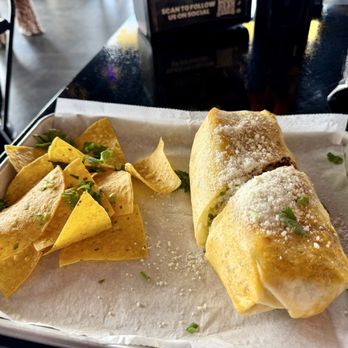 Talkin’ Tacos Loop West - Steak burrito with a side of tortilla chips - Mexican Near Me - Kissimmee, Florida Talkin’ Tacos Loop West - Steak burrito with a side of tortilla chips - Mexican Near Me - Kissimmee, Florida