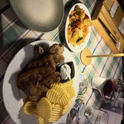Dionysos - Lammschulter or Schulterschnitt (shoulder lamb chops) listed as "Lammkotelett" (rib lamb chops).