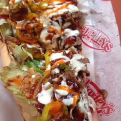 Charleys Cheesesteaks - Cheesesteak with provolone, banana peppers, jalapeños, tomatoes, BBQ sauce, mayo, hot sauce, lettuce, & fried onions.