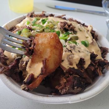 Mabel's BBQ - Loaded potatoes take out -- way bigger than I thought it would be! - Barbeque Near Me - Cleveland, Ohio