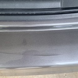 John's Auto Spa - Cracked bumper from the large brush that pounced on my car.