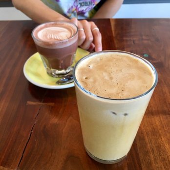 Stowaway Kitchen - Iced cashew milk latte (4+.50) & hot chocolate (back) - Breakfast & Brunch Near Me - Denver, Colorado Stowaway Kitchen - Iced cashew milk latte (4+.50) & hot chocolate (back) - Breakfast & Brunch Near Me - Denver, Colorado