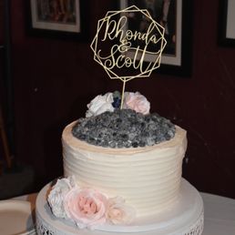 Our wedding cake was gorgeous and tasted amazing! The cake was a lemon blueberry with frosted blueberries on top. The guests raved! Our wedding cake was gorgeous and tasted amazing! The cake was a lemon blueberry with frosted blueberries on top. The guests raved!