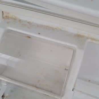 Simple Cleaning Solutions - Dirty fridge before - Home Cleaning Near Me