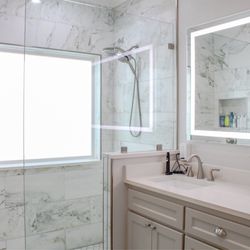 Artisan Homes and Renovations - Bathroom remodel with adjustable light mirror