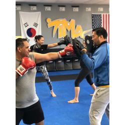 Total Impact Martial Arts - MMA class mitt training