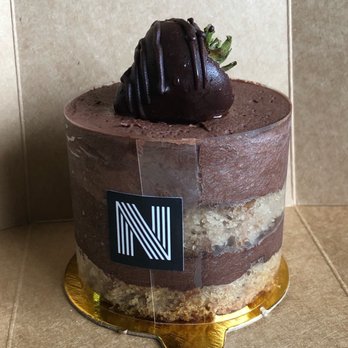Nomada Bakery - a chocolate cake with a strawberry on top - Bakeries Near Me - Huntington, West Virginia