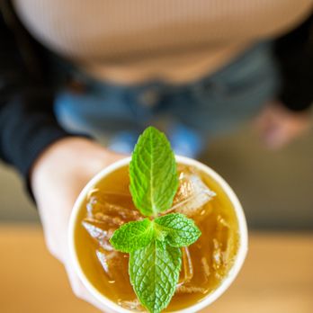 Philz Coffee - a person holding a cup of iced coffee - Coffee & Tea Near Me - Long Beach, California Philz Coffee - a person holding a cup of iced coffee - Coffee & Tea Near Me - Long Beach, California