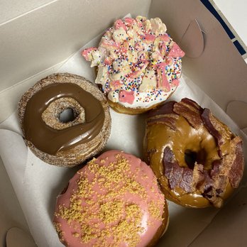 Dunlap's Donuts - Clockwise: Hazelnut cronut, Circus Animal, Bacon Maple, raspberry cream cheese. - Donuts Near Me - Santa Cruz, California Dunlap's Donuts - Clockwise: Hazelnut cronut, Circus Animal, Bacon Maple, raspberry cream cheese. - Donuts Near Me - Santa Cruz, California