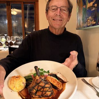Toma Restaurant & Bar - My hubs and his big smile! The grilled pork chop, green beans, mashed potatoes, black carrots. - Bars Near Me - Santa Barbara, California