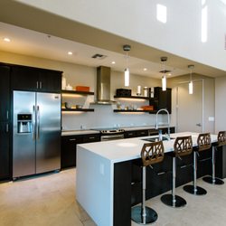Garnet Creek by FPI Management - Social Room with Kitchen and Fireplace