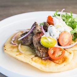 Beeside Balcony - Gyro - lamb, arugula, cherry tomatoes, red onions, and tzatziki.