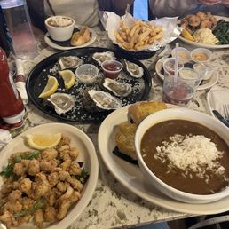 Fried Gater bites, gumbo, oysters, French fries, fried shrimp, crawfish etouffee. Fried Gater bites, gumbo, oysters, French fries, fried shrimp, crawfish etouffee.