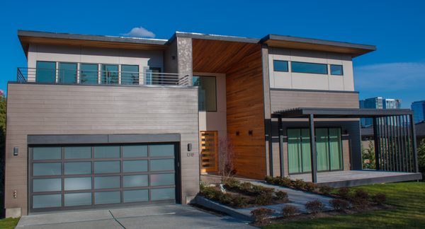 Modern Panel Siding Design - New Construction build in Bellevue. James Hardie Lap and Panel with metal flashing at vertical and horizontal seams. Modern Panel Siding Design - New Construction build in Bellevue. James Hardie Lap and Panel with metal flashing at vertical and horizontal seams.