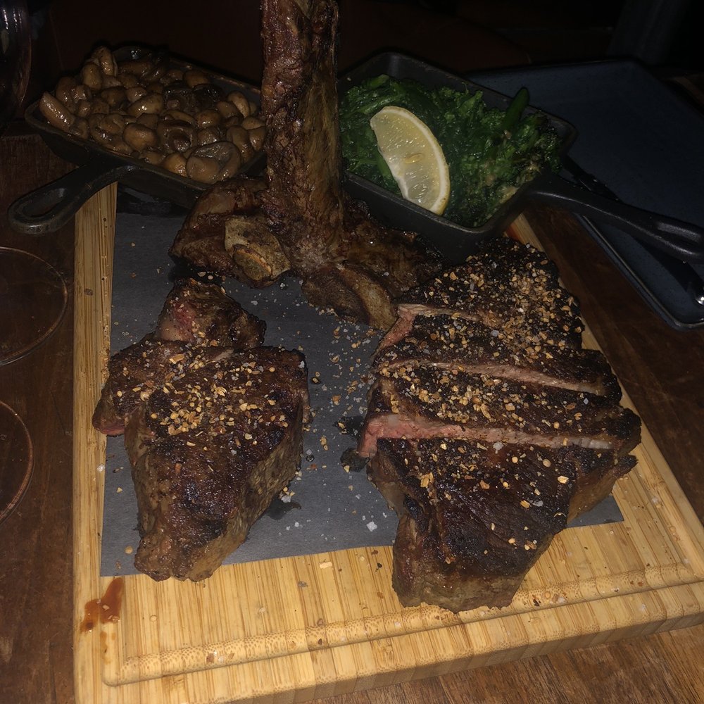 Rib steak with side mushroom and rappini Rib steak with side mushroom and rappini