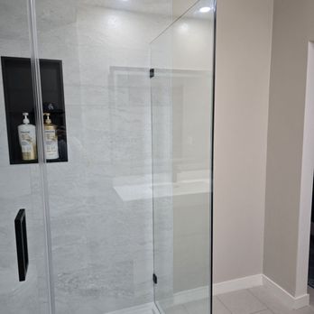 Efficient Bath Solutions - Extra space between shower and entry for hampers - General Contractors Near Me