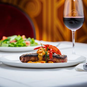 The Precinct - a plate of food and a glass of wine - Steakhouses Near Me - Cincinnati, Ohio The Precinct - a plate of food and a glass of wine - Steakhouses Near Me - Cincinnati, Ohio