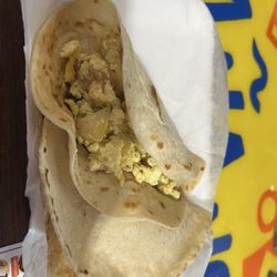 Potato and egg in flour tortilla and chorizo and egg in corn tortilla (tacos)