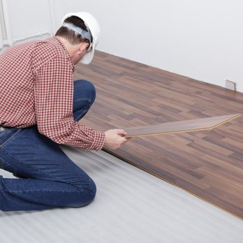 Millennium Flooring Group - a man installing a hardwood floor - Flooring Near Me Millennium Flooring Group - a man installing a hardwood floor - Flooring Near Me