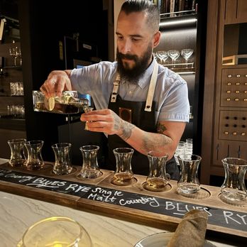 Stone Groove Stillhouse - Bartender putting together our flights - Distilleries Near Me - Anaheim, California Stone Groove Stillhouse - Bartender putting together our flights - Distilleries Near Me - Anaheim, California
