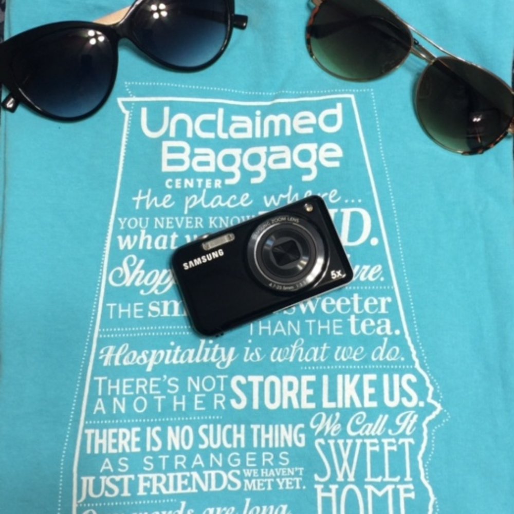 Unclaimed Baggage - Some of my purchase. $5 Express sunglasses, $10 camera in brand new conditions that is originally $149, and a Unclaimed Baggage shirt! - Luggage Near Me - Scottsboro, Alabama Unclaimed Baggage - Some of my purchase. $5 Express sunglasses, $10 camera in brand new conditions that is originally $149, and a Unclaimed Baggage shirt! - Luggage Near Me - Scottsboro, Alabama