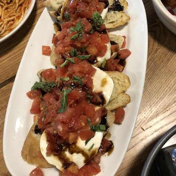 Giordano's - the best brushetta ever! tomatoes very tasty, ftesh tasting mozarella... plate had 4 we wanted more and more - Pizza Near Me - Kissimmee, Florida