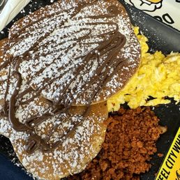 Delicious egg combo breakfast with veggie chorizo and Nutella hot cakes. Delicious egg combo breakfast with veggie chorizo and Nutella hot cakes.