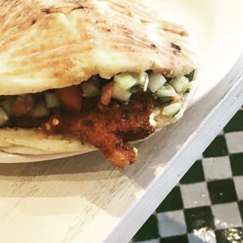 Bite - the Mediterranean Chicken Schnitzel sandwich in a pita. - Salad Near Me - New York, New York